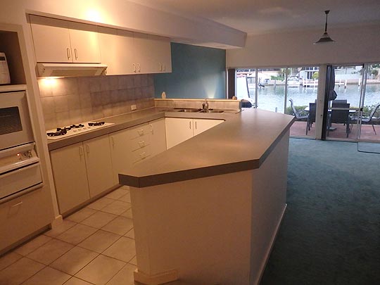 Watch for dolphins whilst doing the dishes. Mandurah Canal kitchen with fridge freezer, oven, cook top, dishwasher and pantry