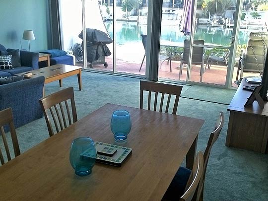 Port Sails Canal Villa, Mandurah lounge and dining room with canal views